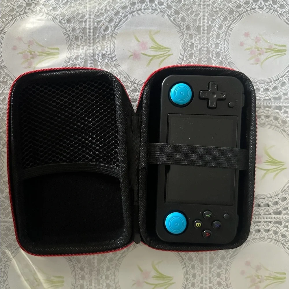 Black Handheld Gaming Console with Blue Accents